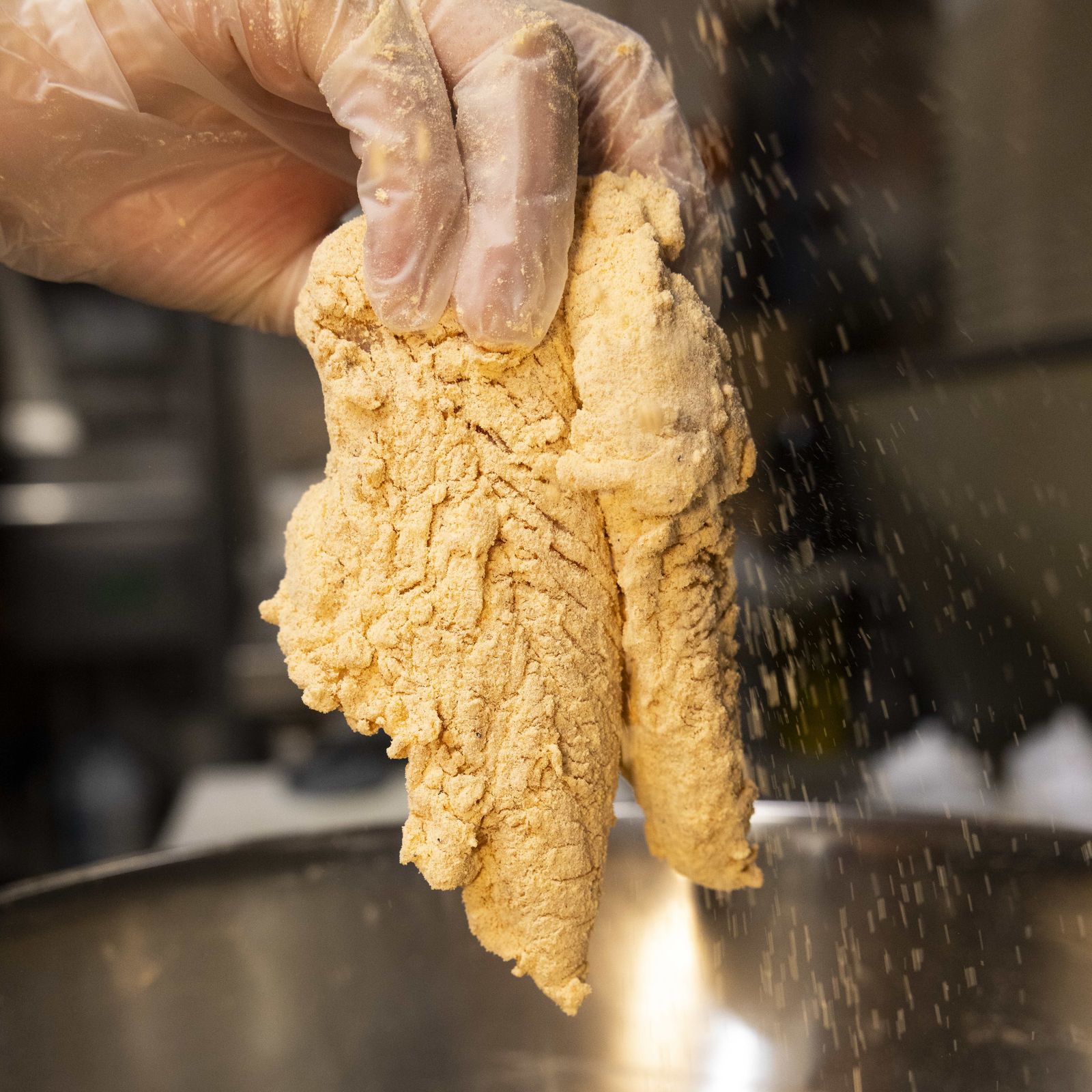 Hand-breaded chicken preparation